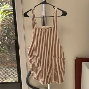 Striped overall with pockets in the front.